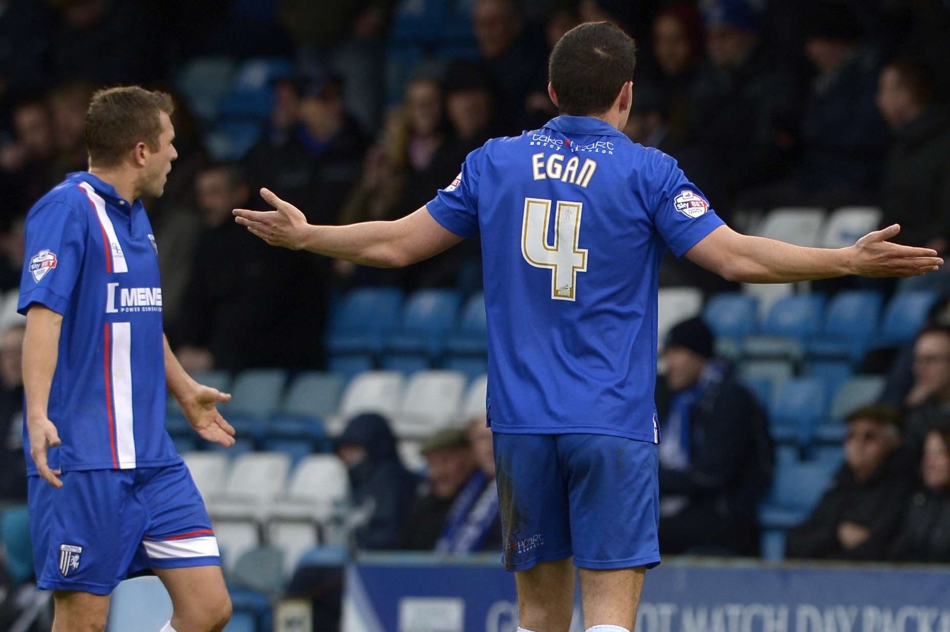 John Egan and Doug Loft appeal for a penalty against Colchester Picture: Barry Goodwin