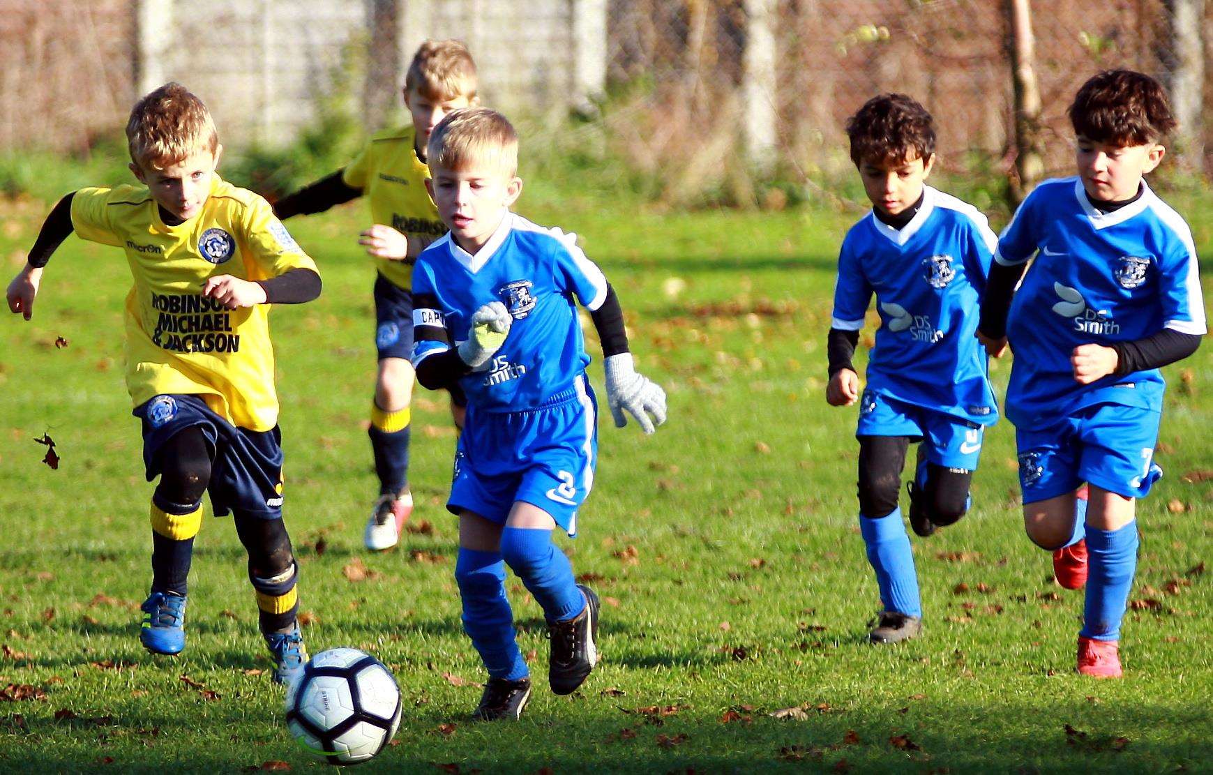 Medway United East (blue) take on Iwade Herons United in the Under-7 Trophy Event Picture: Phil Lee