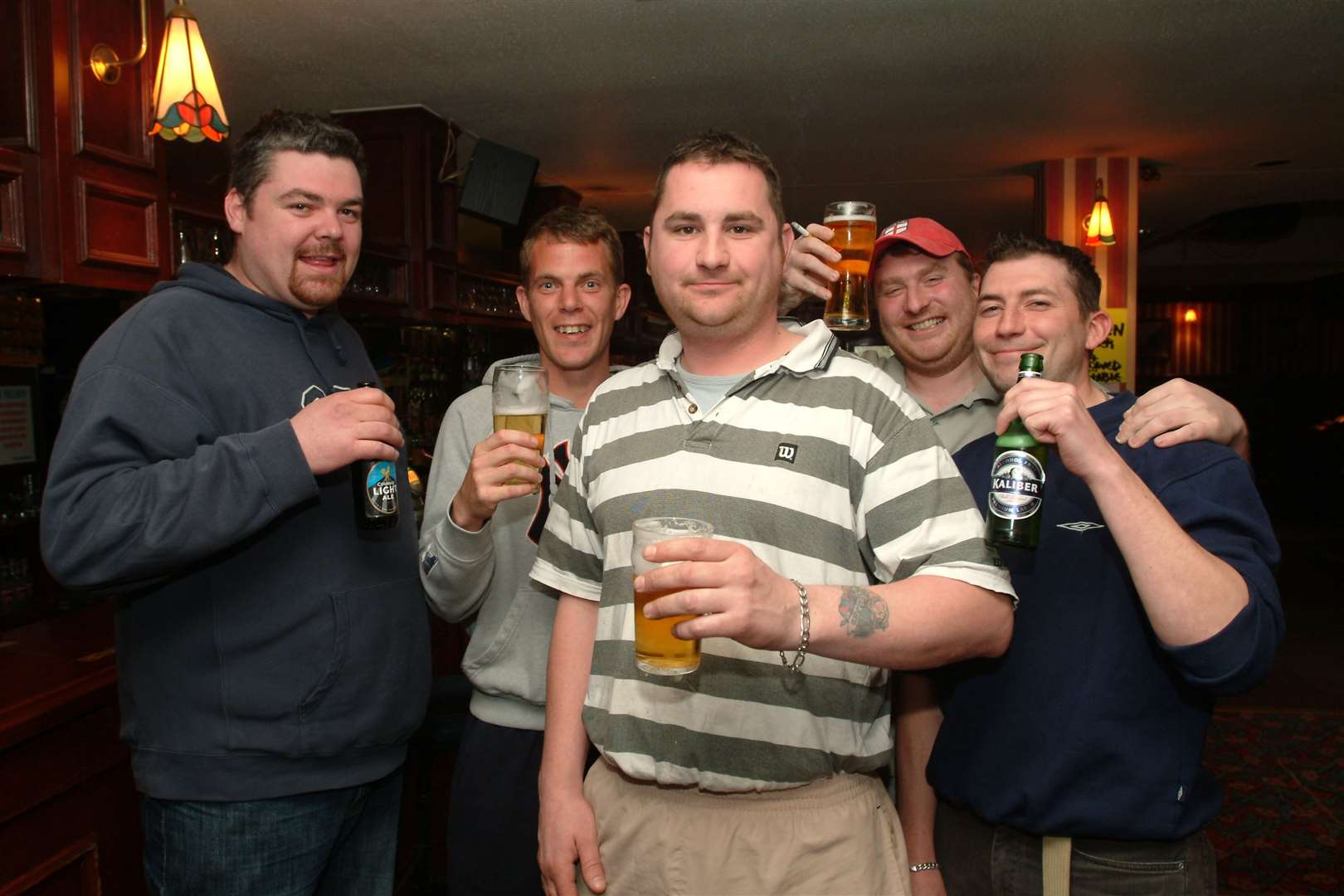 Steve Penfold, centre, caught a baby flung 30ft from a blazing block of flats in Stanhope, Ashford, in April 2005. Here he is pictured at The Nelson pub, which was sadly demolished in 2011