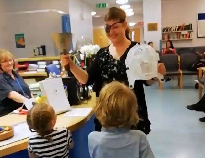 Toni Crews ringing the bell to mark the end of her cancer treatment in 2019