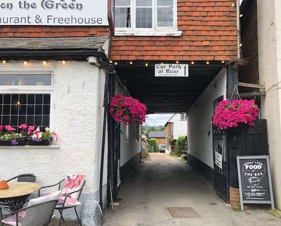 There is a narrow alleyway to the right-hand side of the pub which leads to the car park at the back