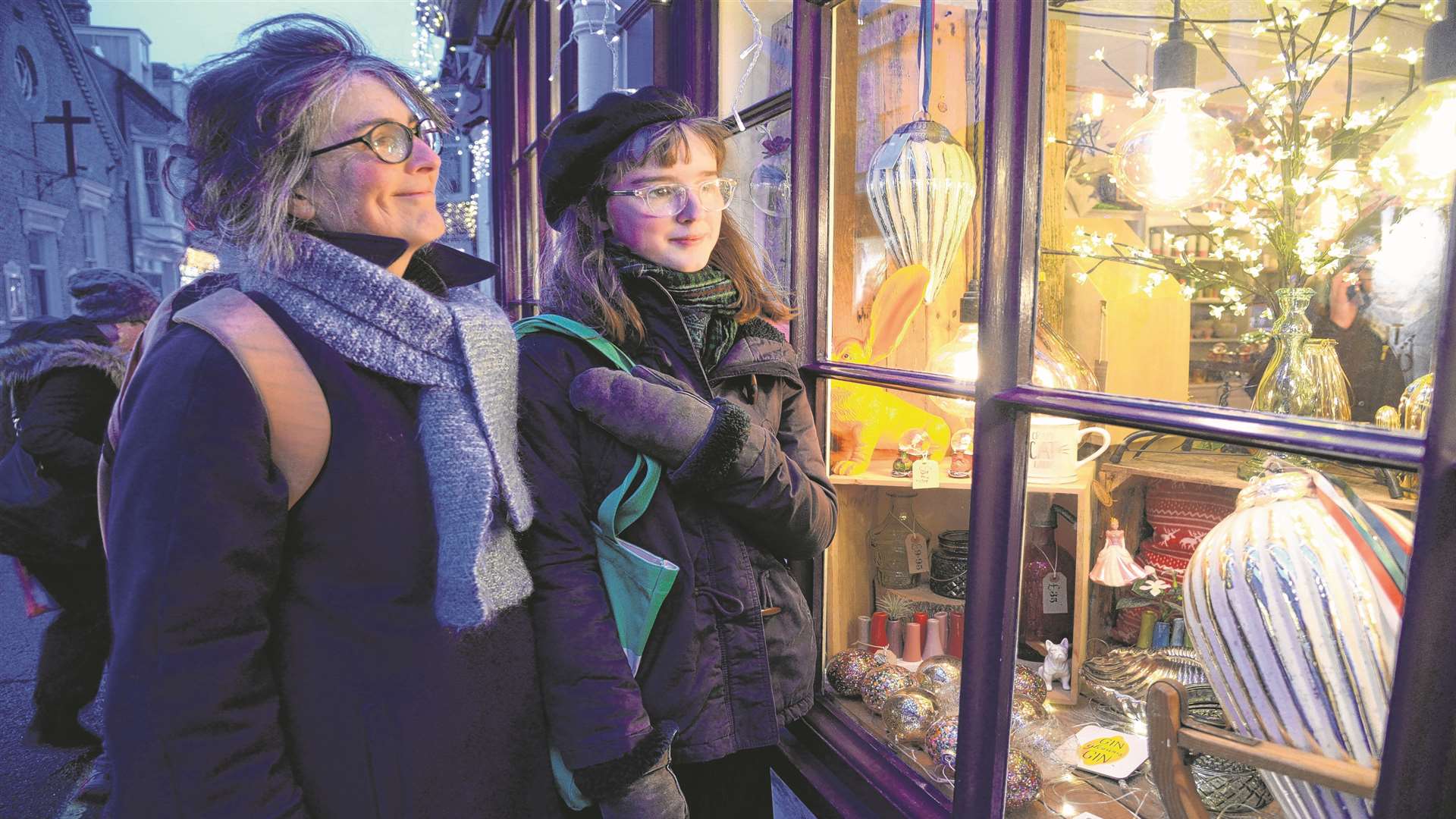 Efua Thomas and Erica Williams take a peek through the window of one of the shops in Harbour Street