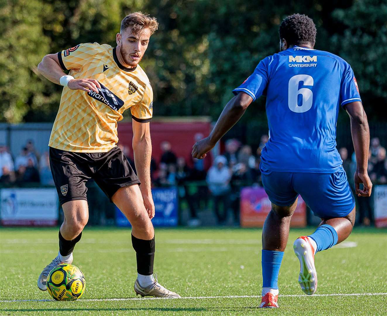 Maidstone's Crawley loanee Antony Papadopoulos faces Herne Bay’s Mo Kamara. Picture: Helen Cooper