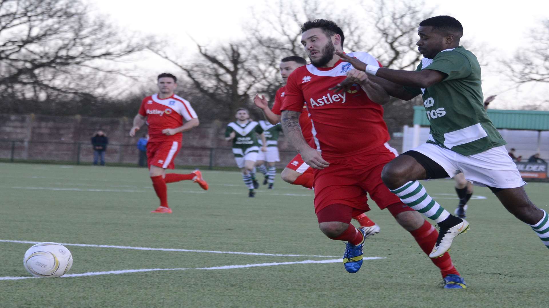 Ashford United's Ryan Palmer challenges for the ball with a Dunston defender in the 1-1 FA Vase draw at Homelands last season Pic: Paul Amos