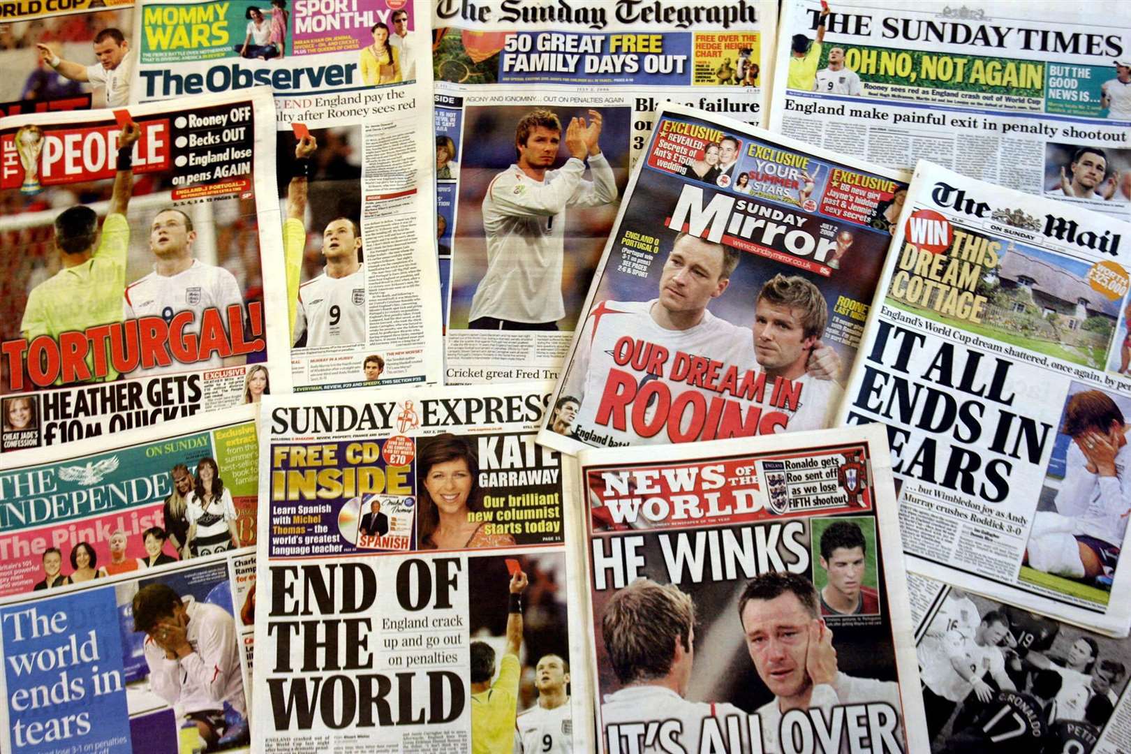 Newspaper headlines after England’s quarter-final exit from the 2006 World Cup in a shoot-out against Portugal (Chris Young/PA)