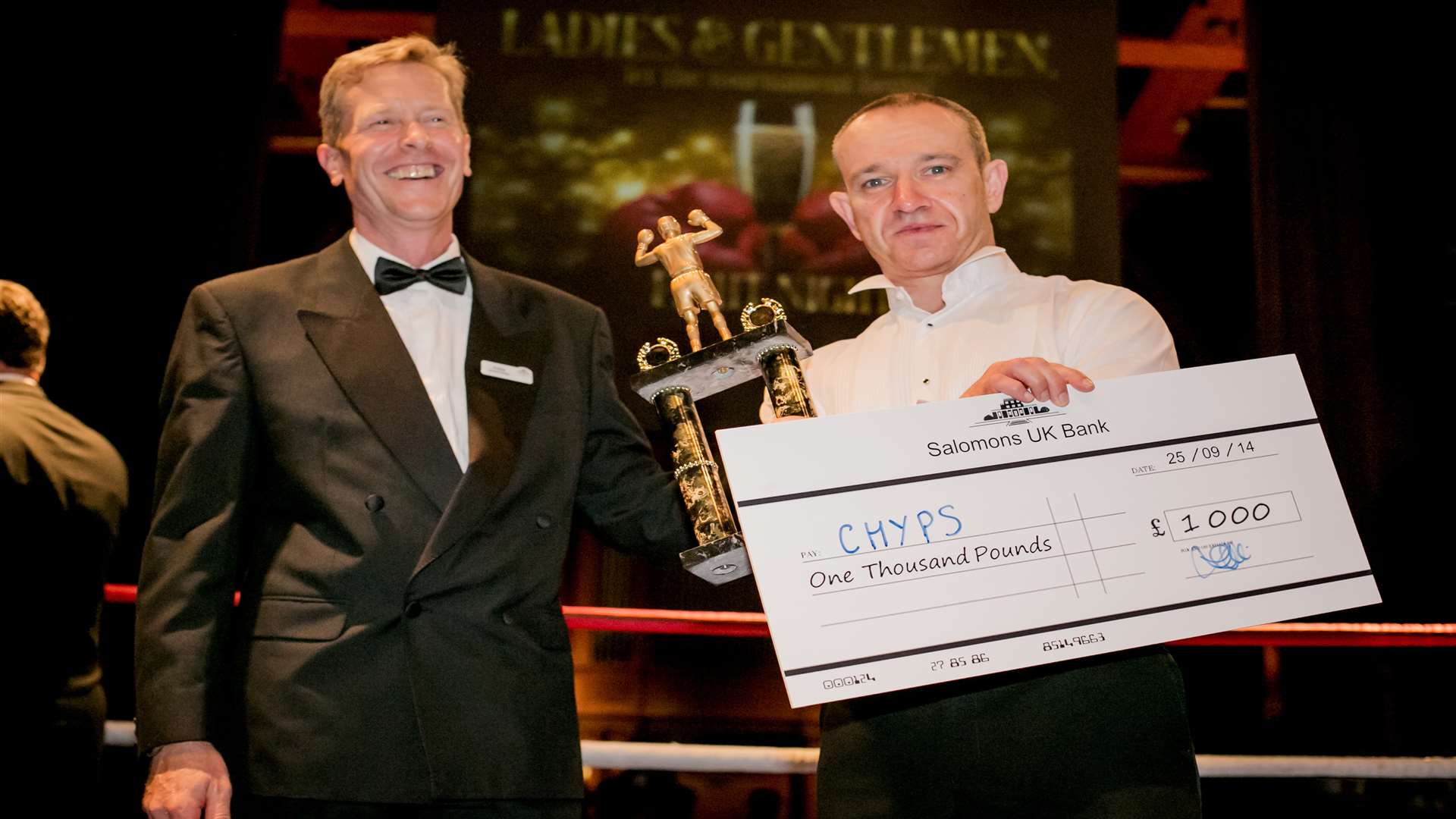 Darren 'Powers' Austin with his winning cheque