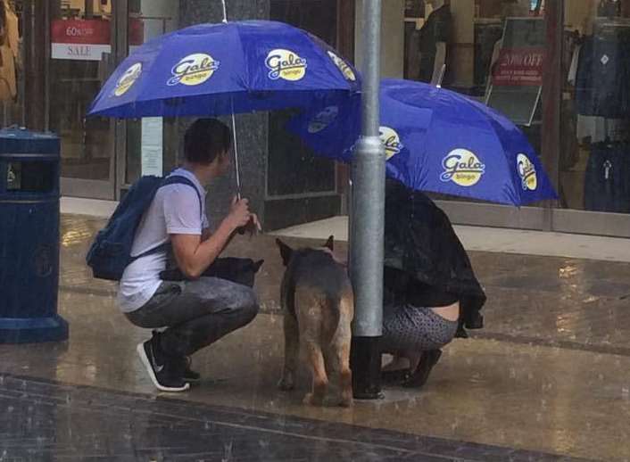 Bradley and Elise received Gala Bingo umbrellas from worker Jon Sparkes