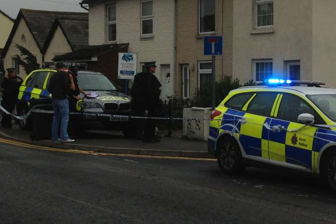 Some of the armed officers who surrounded a house