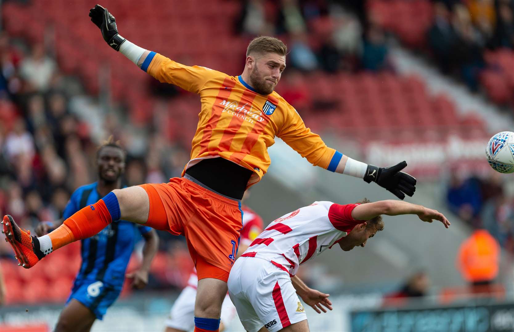 Gillingham keeper Tomas Holy challenges with Herbie Kane. Picture: Ady Kerry