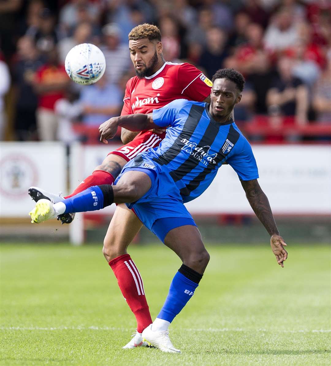 Gillingham's Brandon Hanlan challenges with Accrington's Ben Richards-Everton. Picture: Ady Kerry