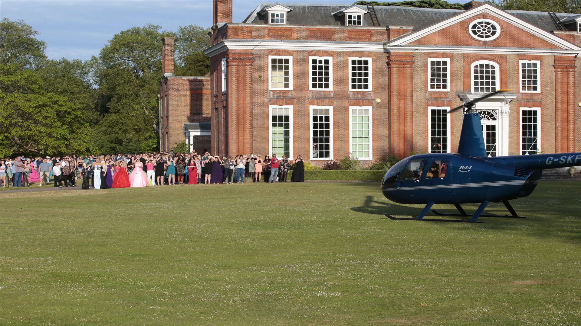 Students and staff gather to see the arrival