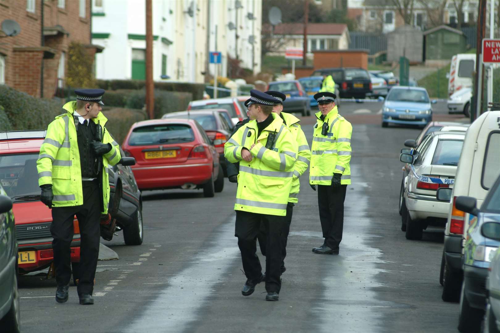 Officers investigating the scene of the murder in Denmark Street on January 31, 2006