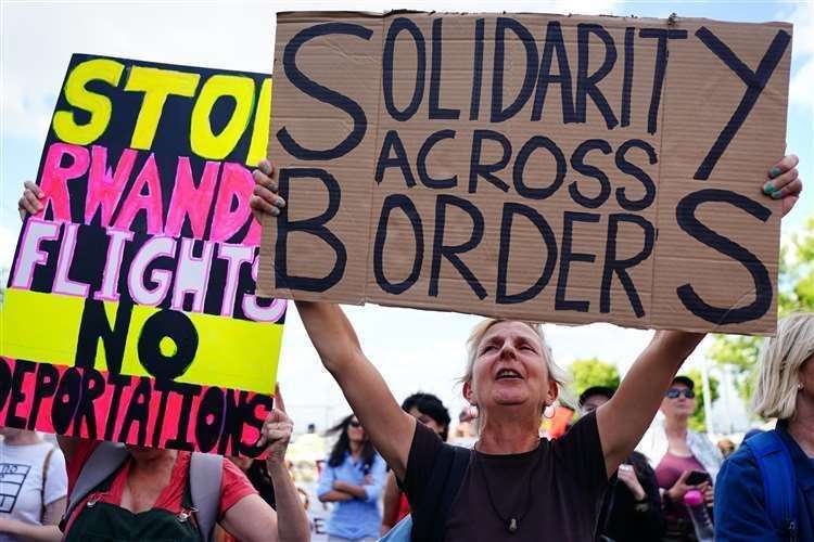 Demonstrators protest against plans to send migrants to Rwanda. Picture: Victoria Jones/PA