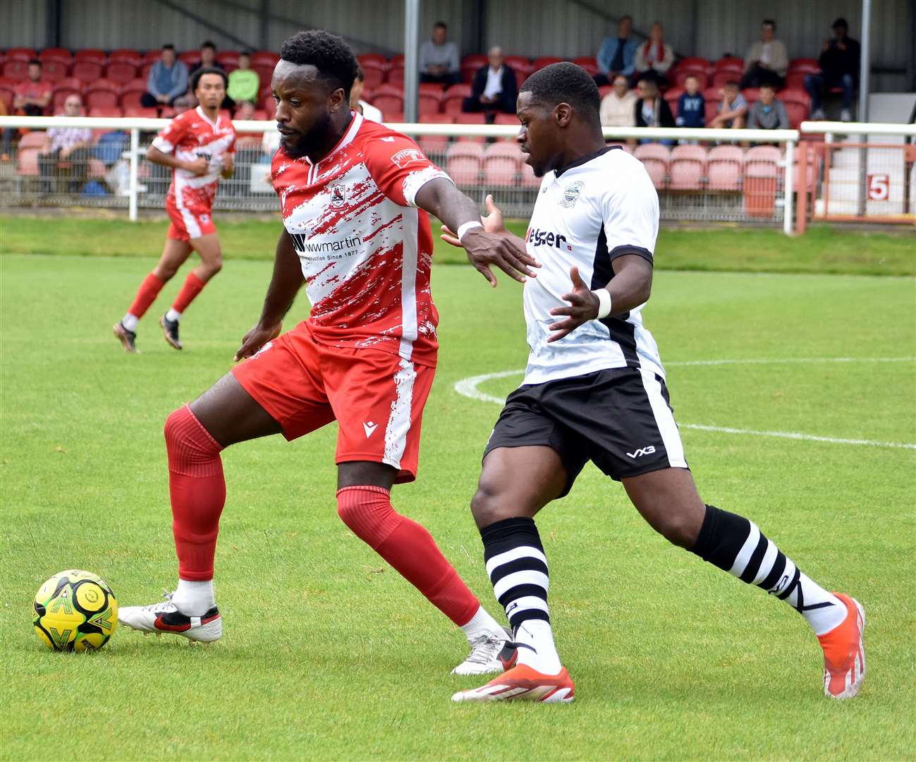 Ramsgate's Aaron Barnes, left, keeps Dover at bay. Picture: Randolph File