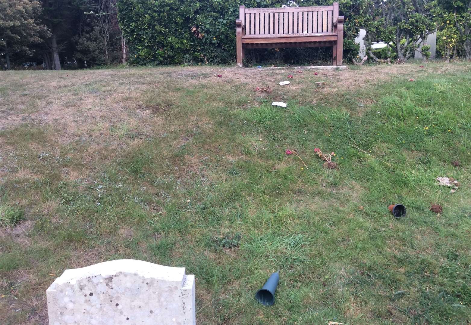 Flowers were pulled up and plant pots scattered near the graves