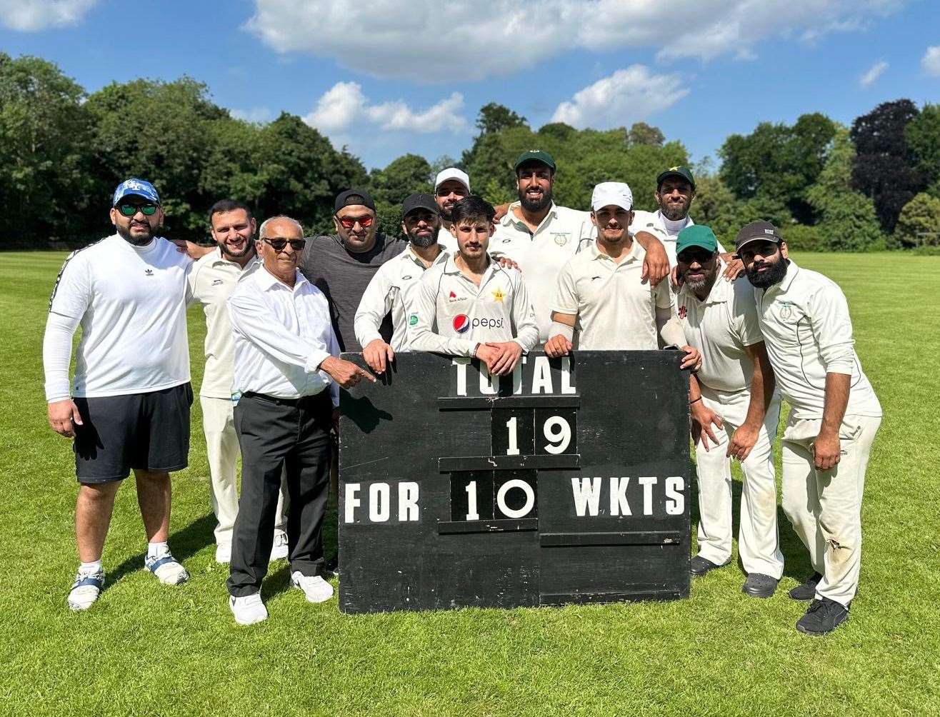 Mohammad Yaseen, centre, with Holborough team-mates after bowling out Bearsted for 19.