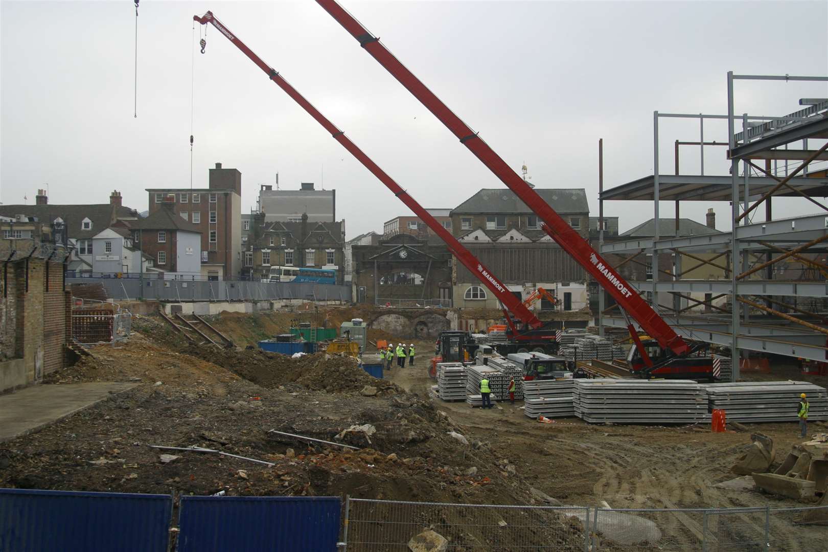 Cranes are lowered at the Fremlin Walk site to observe a two-minute silence. Pic: Mike Mahoney