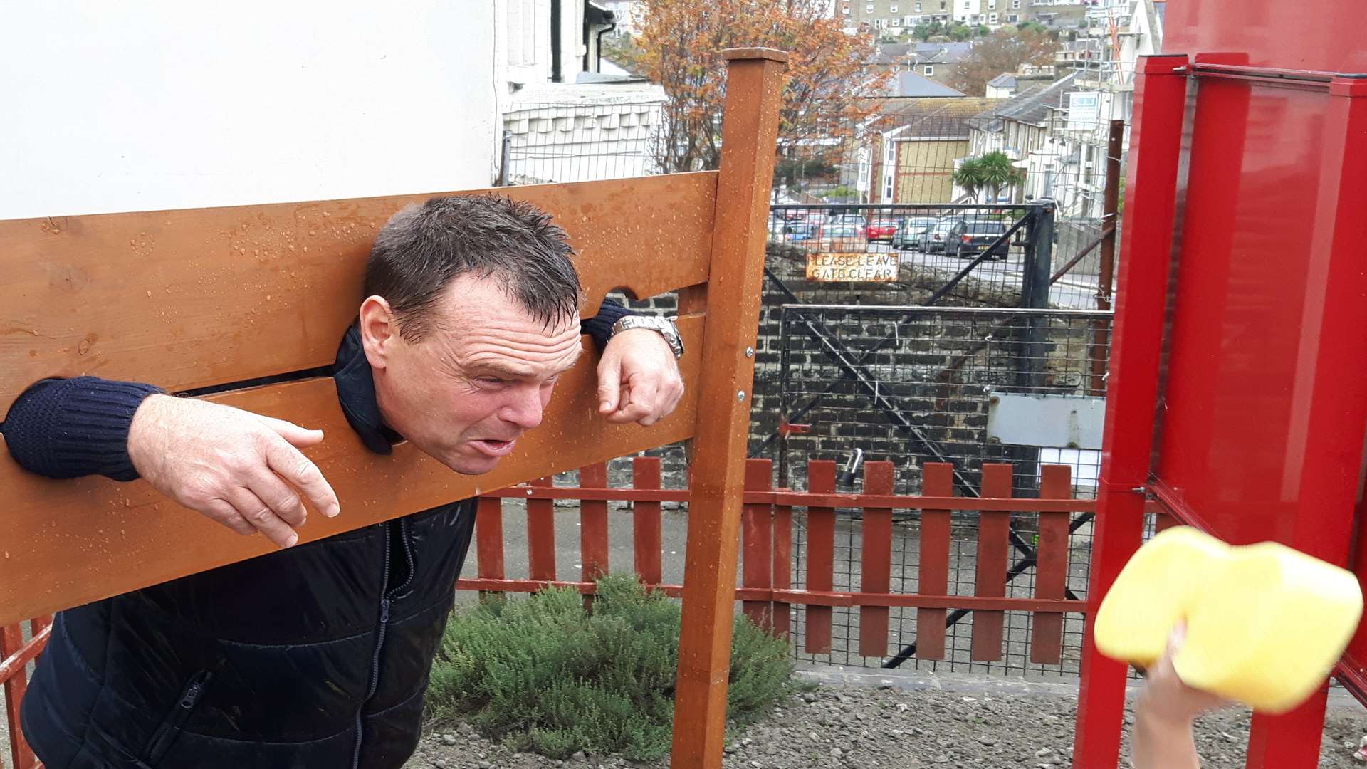 Here it comes, Cllr John Heron about to get hit by a wet sponge.