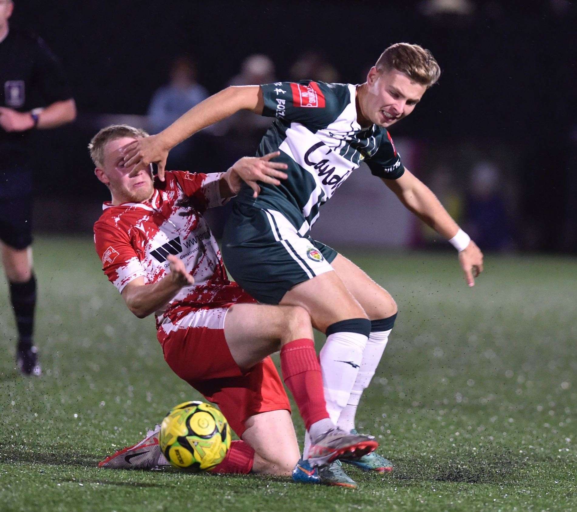 Ashford United man Jack Saunders is challenged by Benny Bioletti at Ramsgate. Picture: Ian Scammell