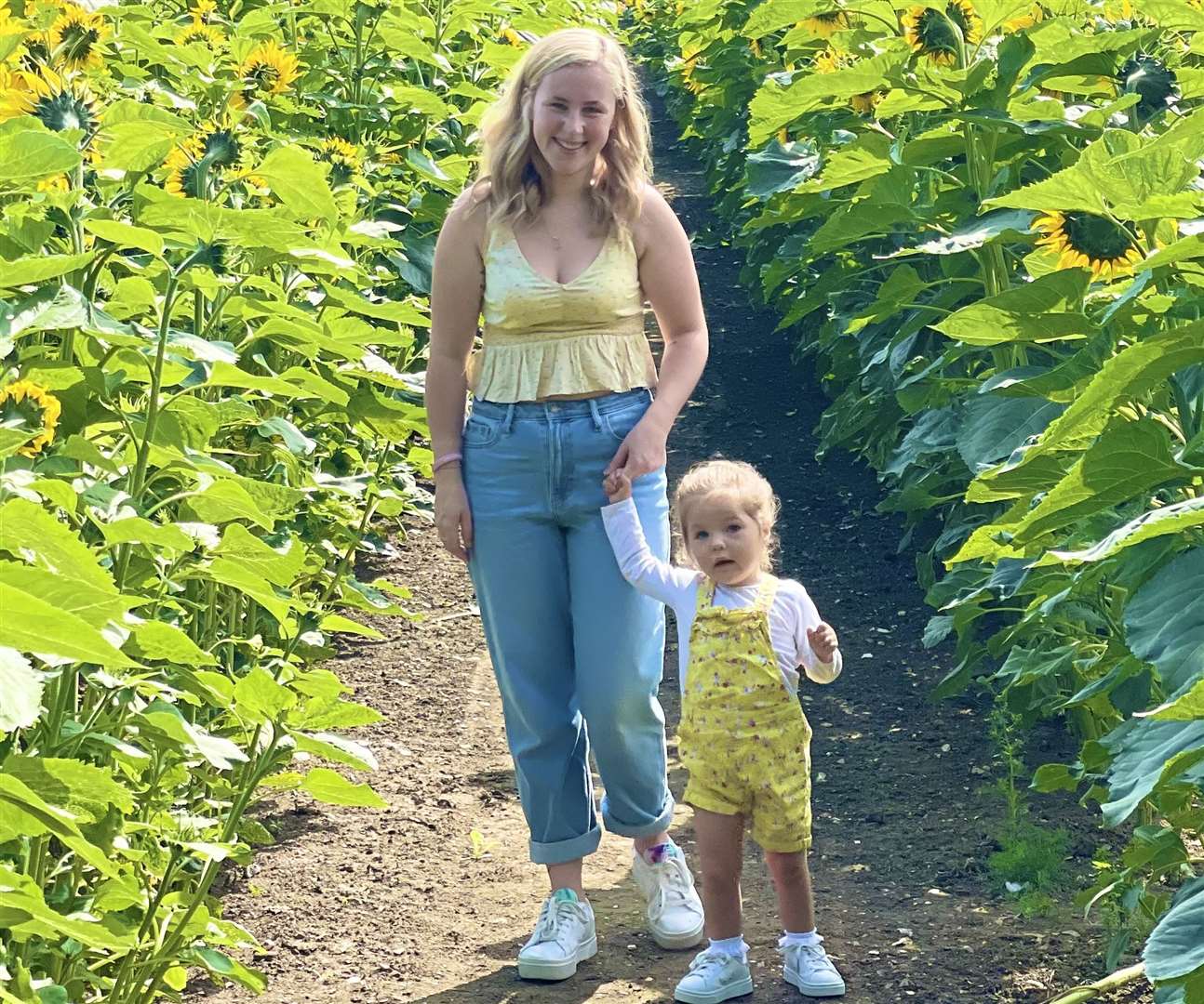 Toddler Hallie with mum Rachael before her condition started to deteriorate