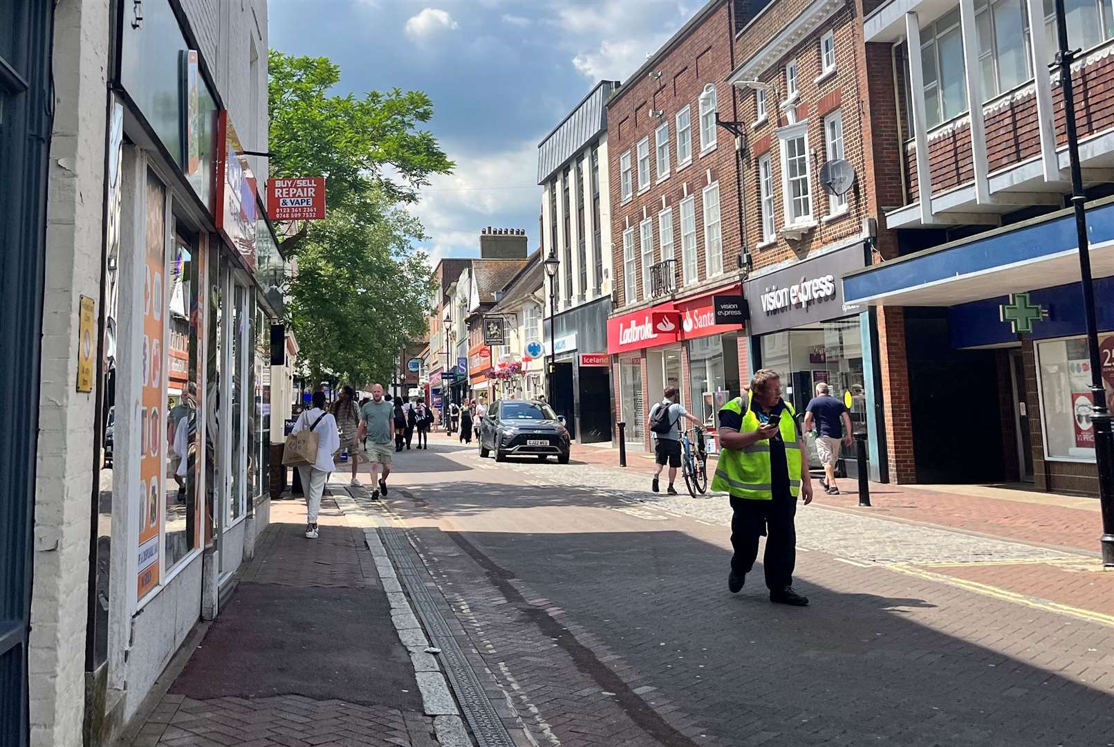 A man in his 30s suffered head injuries after he was attacked in Ashford High Street