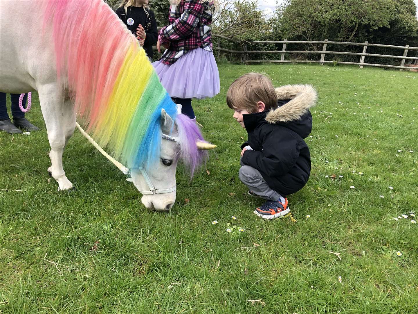 One child meeting Henny the unicorn