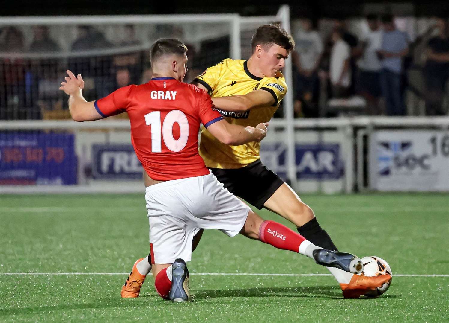 Maidstone full-back Ben Brookes gets to the ball first on Tuesday night. Picture: Helen Cooper