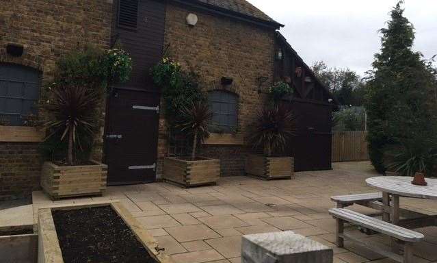 It was too chilly for anyone to be sitting outside but the patio area, with its troughs and pots, is as spick and span as everywhere else