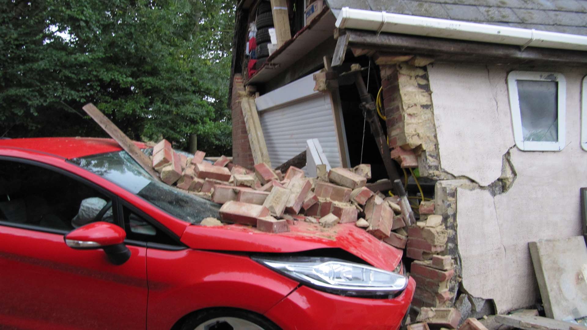 The car smashed into the side of the garage.