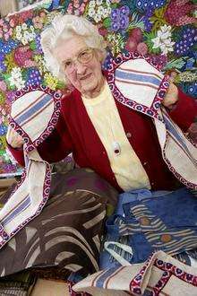 Elsie Negus is pictured at her open house sale of her sewn goods and other donations