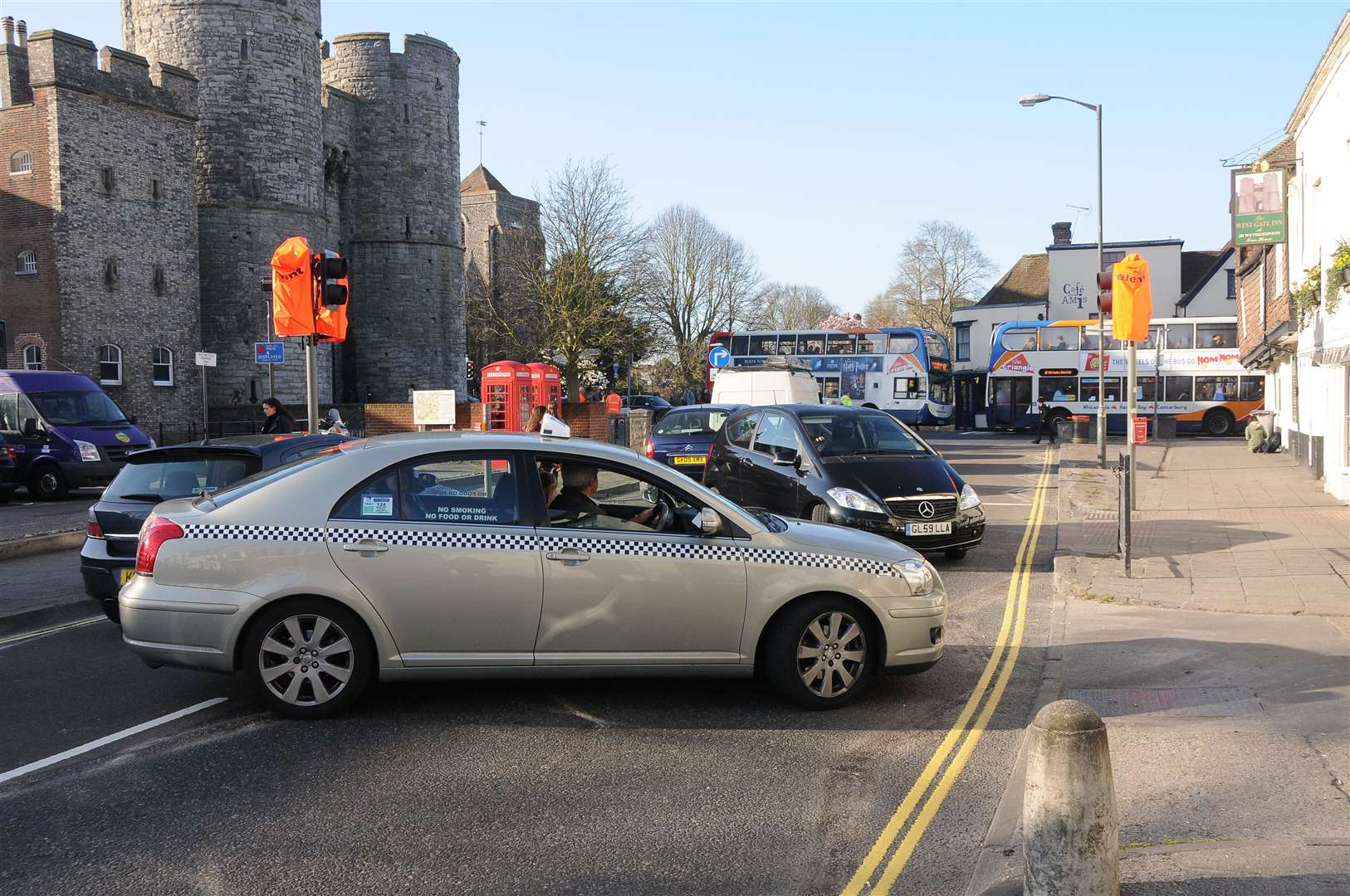 Cars and buses going in all directions as drivers attempt to make u-turns to avoid the traffic chaos