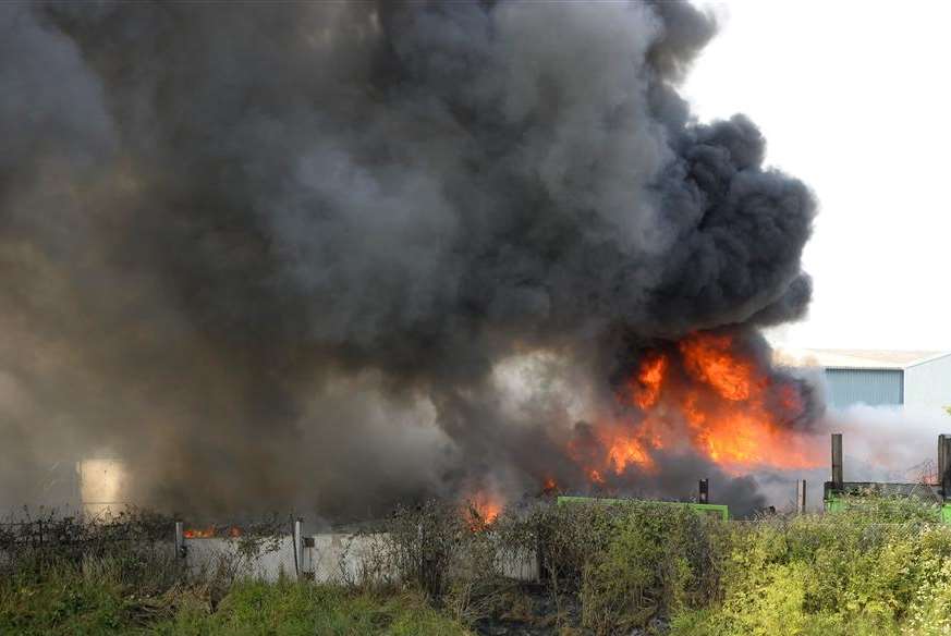 The fire still burning at the recycling depot at 3.45pm - more than seven hours after the blaze broke out. Picture: Andy Payton