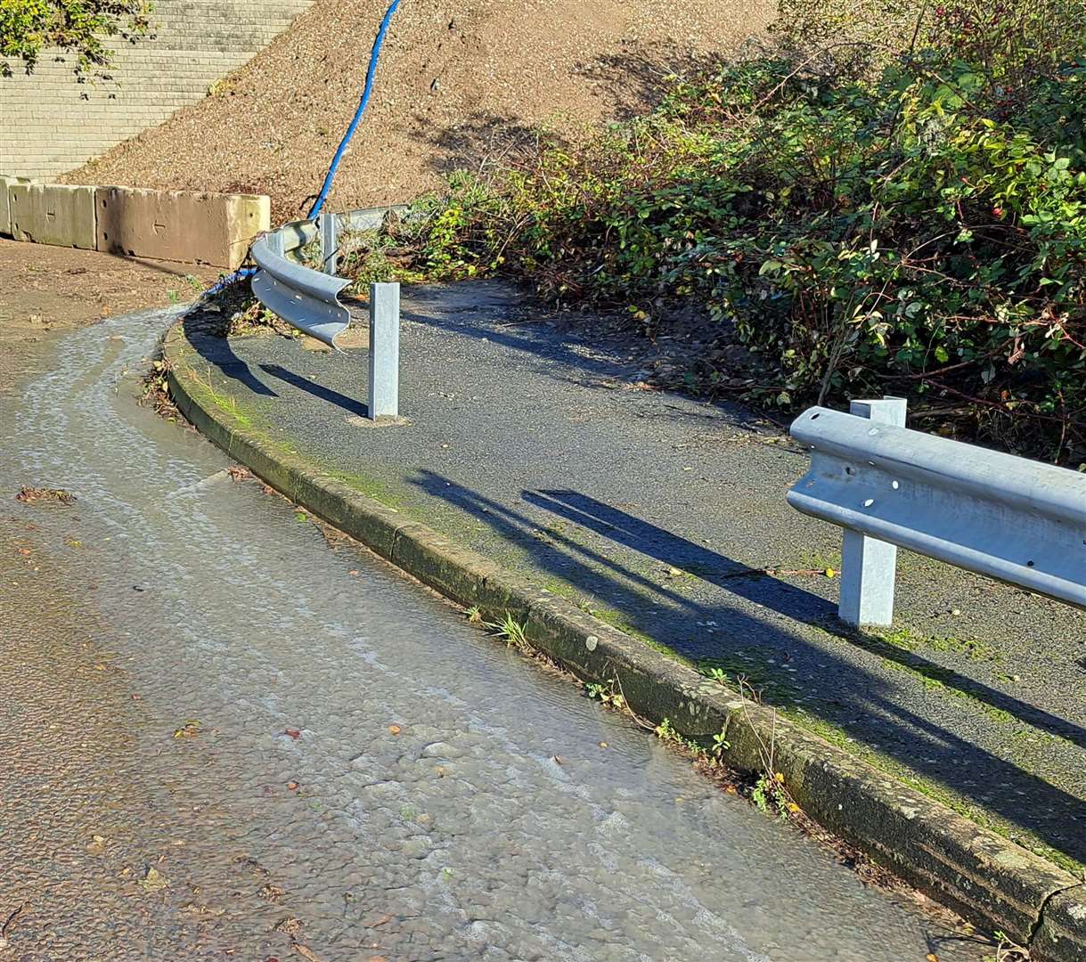 Water coming downhill from a hosepipe is adding to the flooding