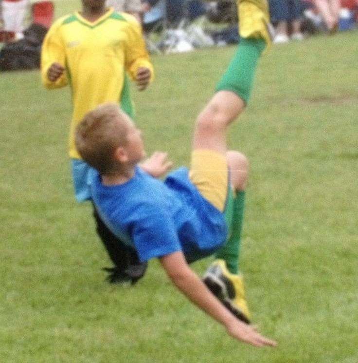 Taylor Perkins -pictured when he was younger - was an avid football fan and Manchester United supporter