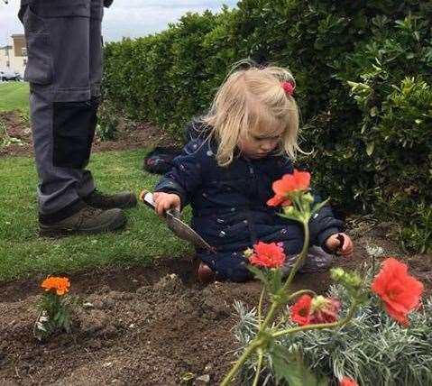 Carys Gregory gets stuck in as the group try to improve Cliftonville seafront near the shelter. Picture: FOCC