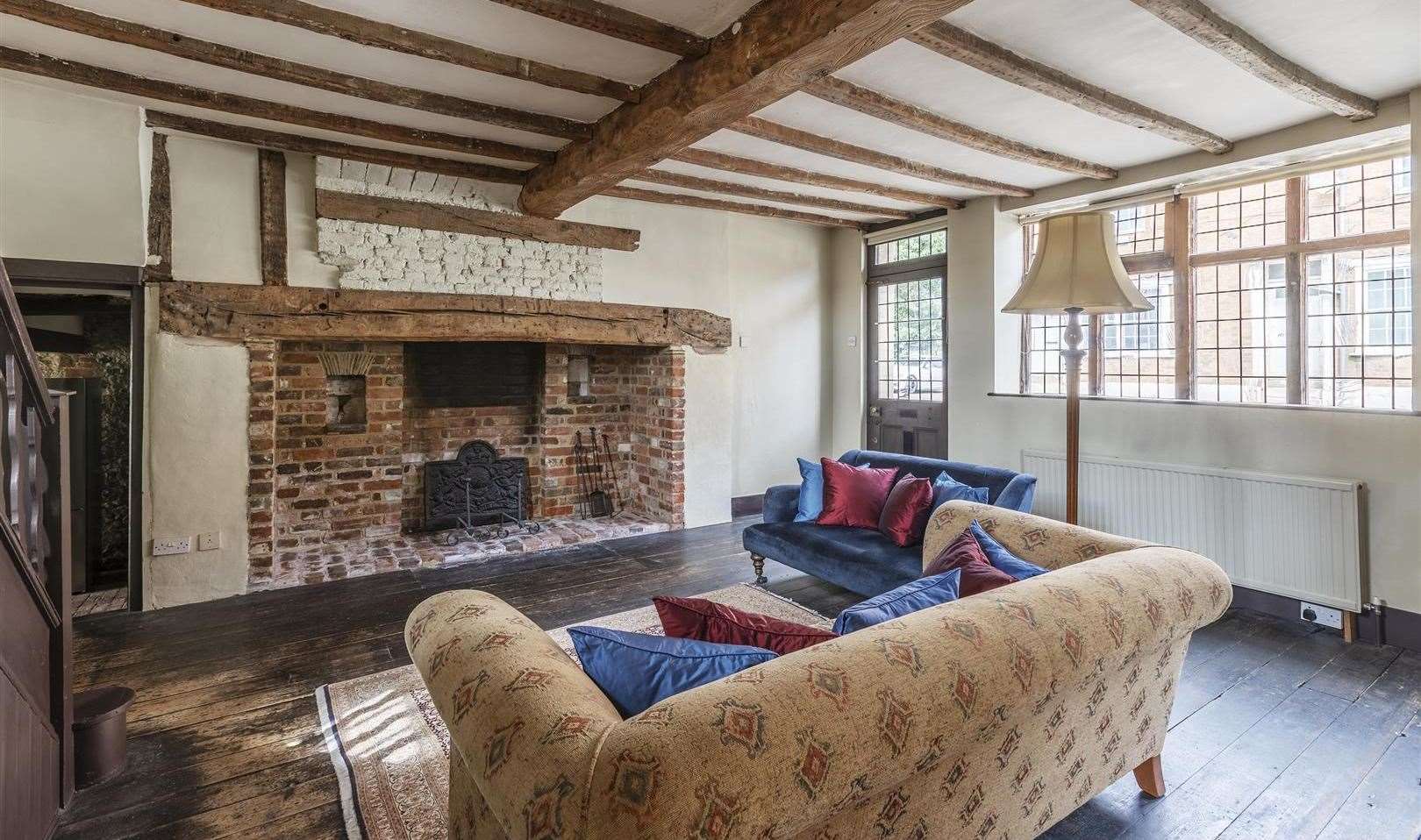 The beamed living room leads out into the cottage-style garden. Picture: Saxon Shore