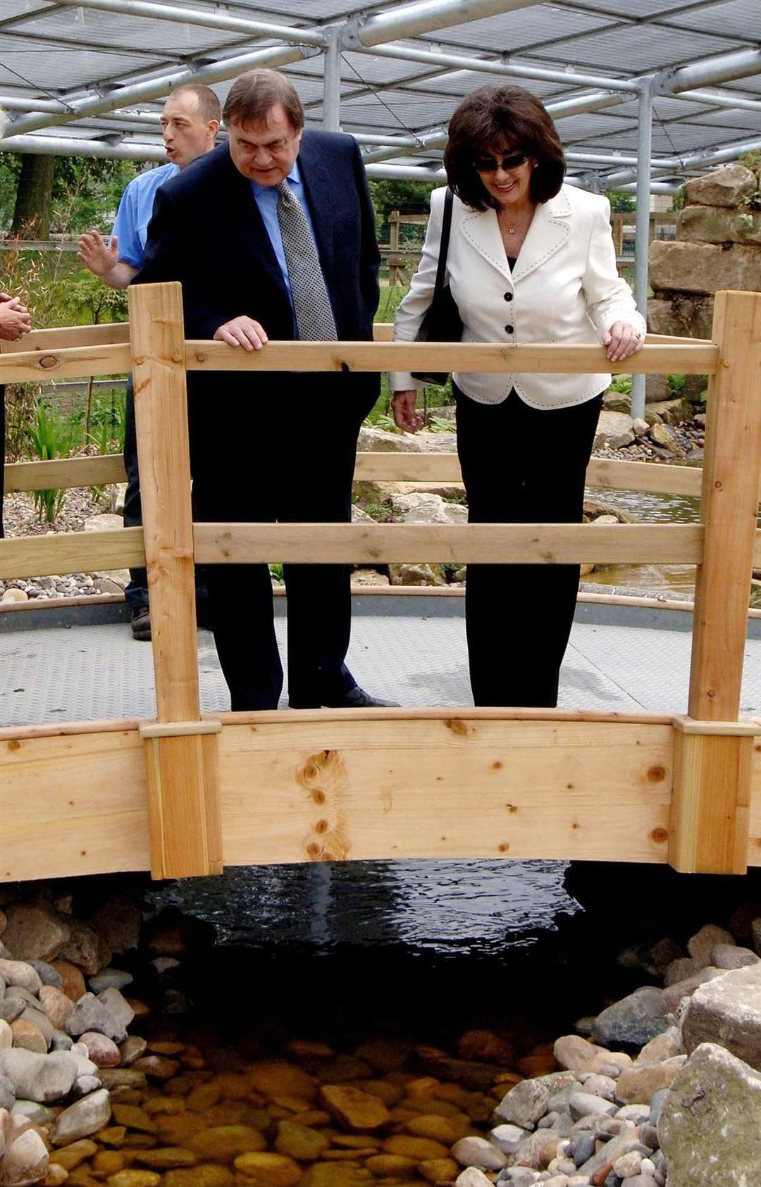 Deputy Prime Minister John Prescott and his wife Pauline cross a footbridge during a visit to East Park in his constituency of Hull (John Giles/PA)