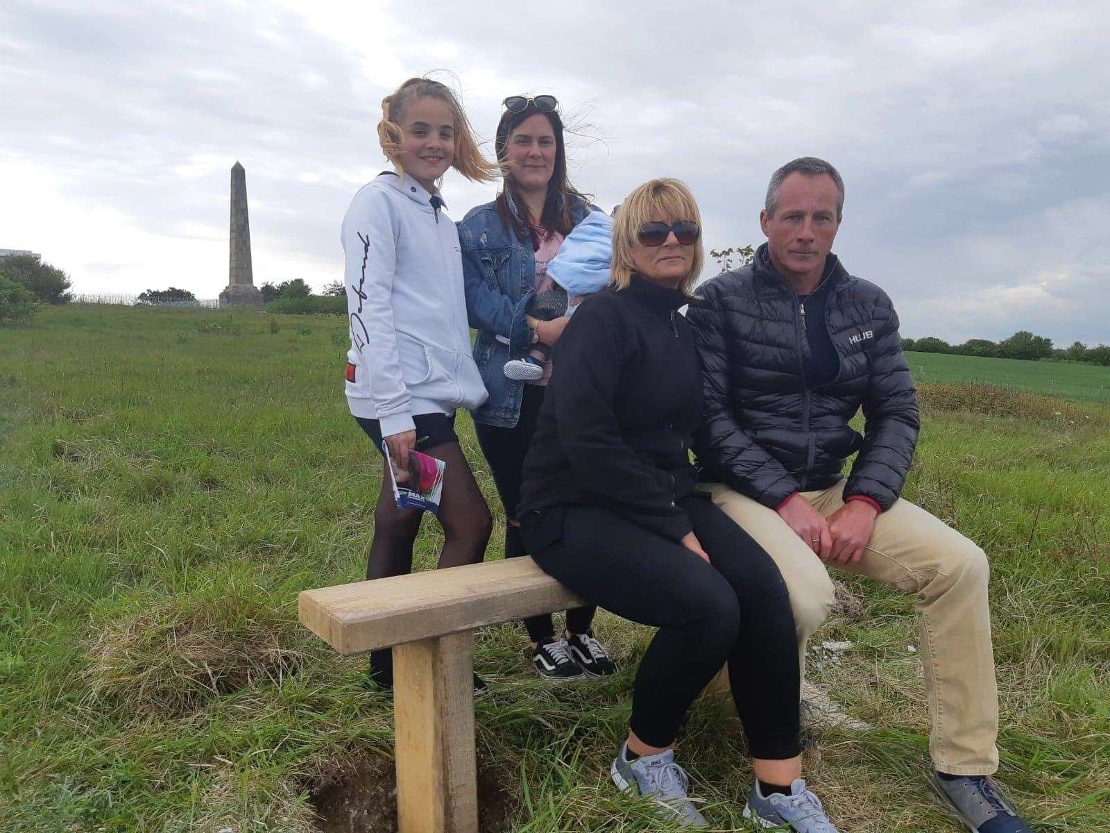 Daniel Squire's family niece Keira, sister Hayley, nephew Ezra and parents Tracy and Symon Squire gather at the bench (11819621)