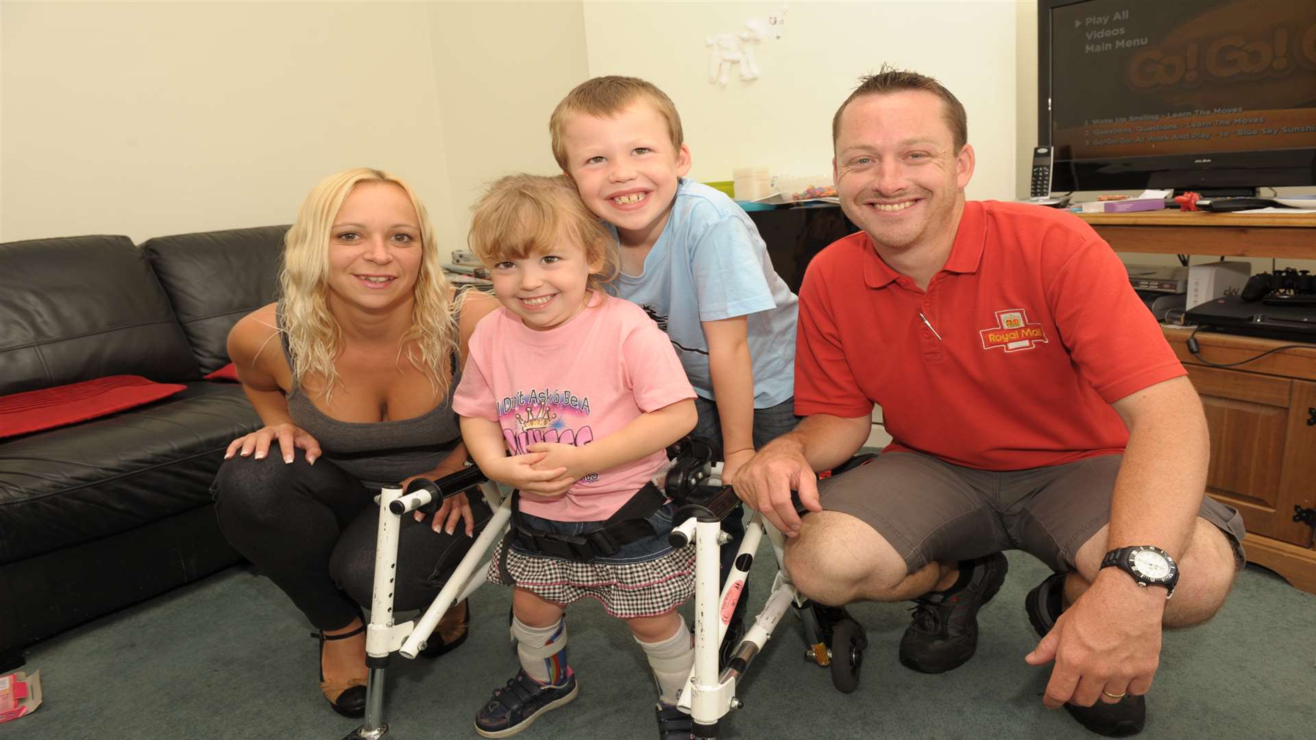 Paige with her parents, Julie and David Stewart, and her brother Craig in 2014