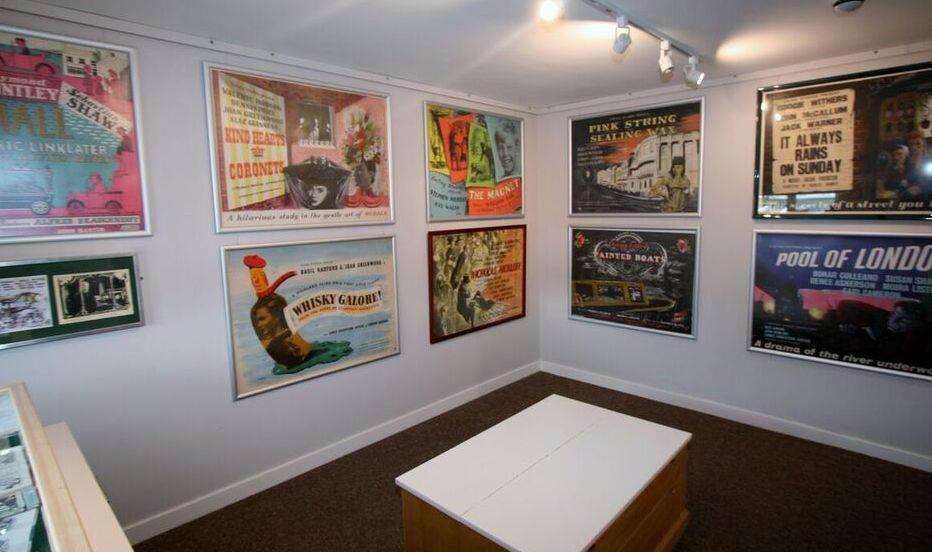 Hand painted film posters promote Ealing Studios films