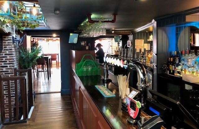 The bar and the rooms at the front have a large number of old beams across their low ceilings, but the bar itself is very modern