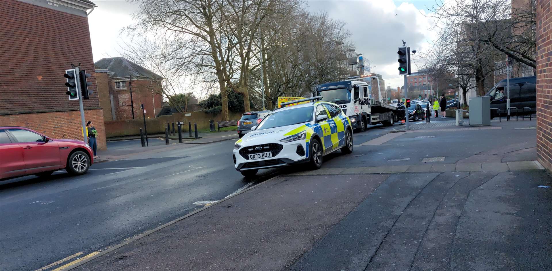 Two police cars and an ambulance were at the scene