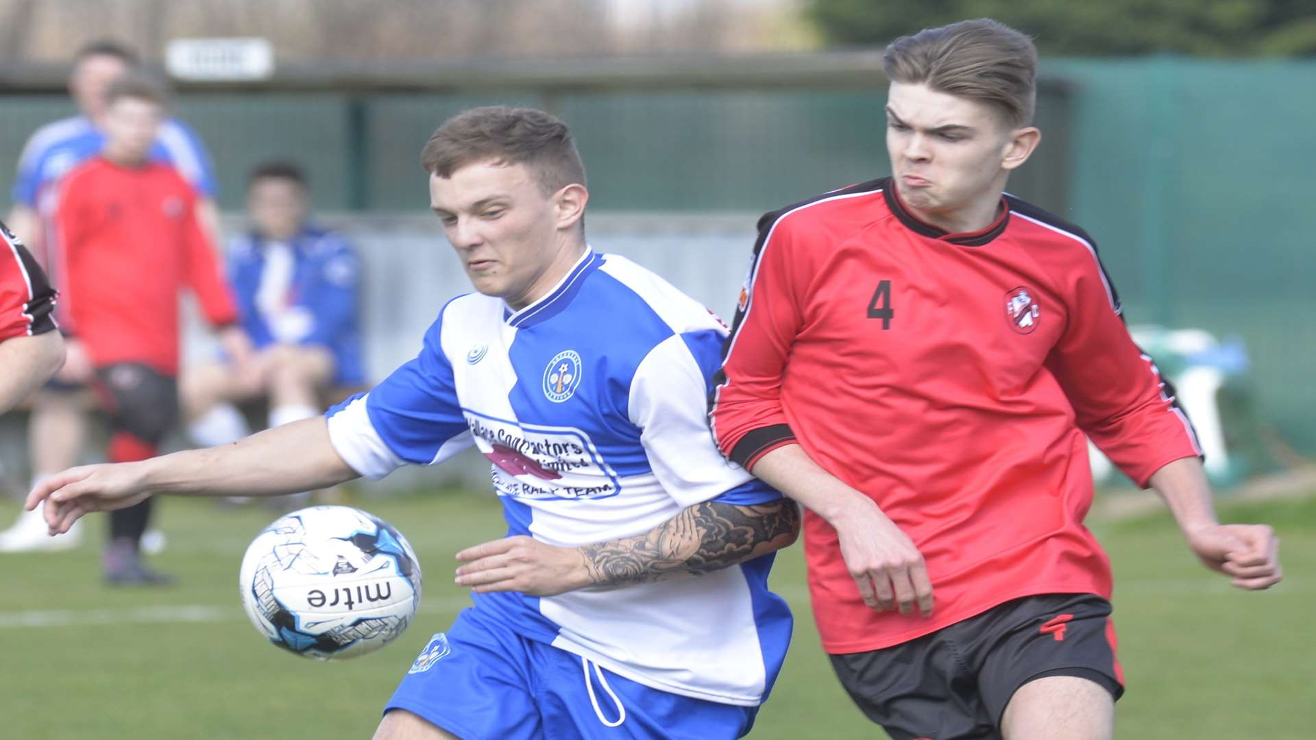 Under-18 sides Bredhurst Juniors (blue and white) and Rainham Kenilworth United go head-to-head in the John Leeds Trophy final Picture: Ruth Cuerden