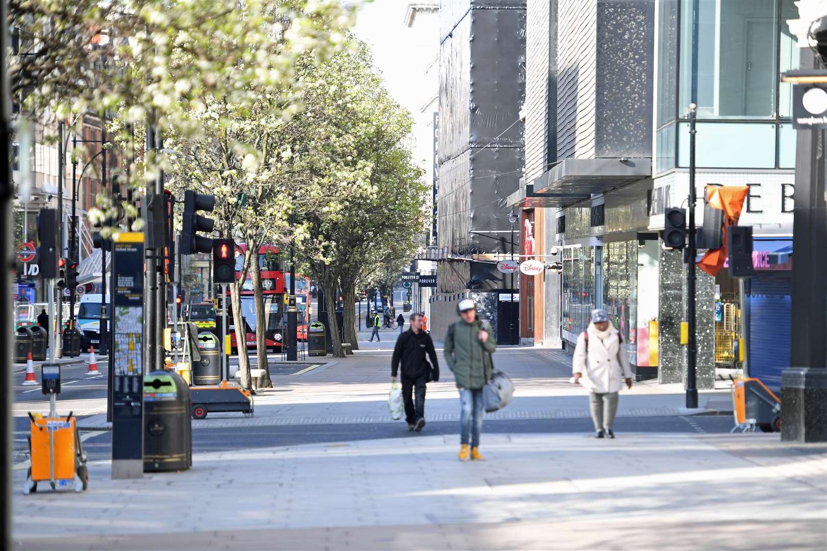 A near-deserted Oxford Street, usually one of Britain’s busiest shopping areas, during the lockdown (PA)