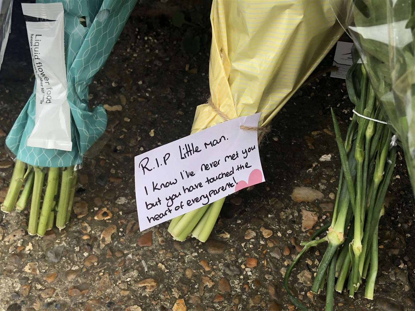 Floral, candle and basketball tributes have been laid in Vale Road