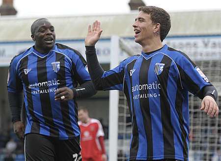 Cody McDonald and Adebayo Akinfenwa in celebratory mood