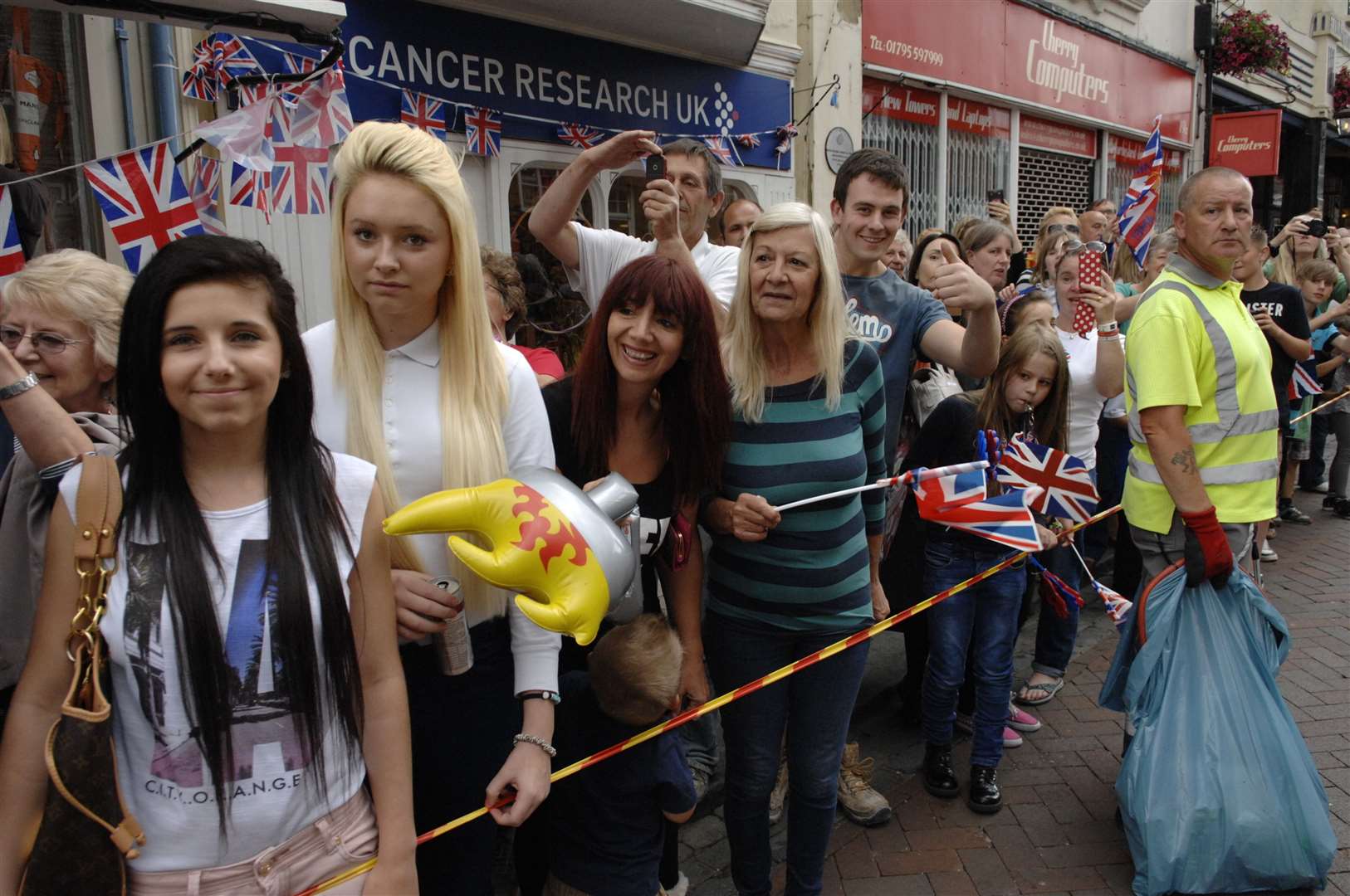 The scene in Preston Street, Faversham, on the torch's third day in Kent