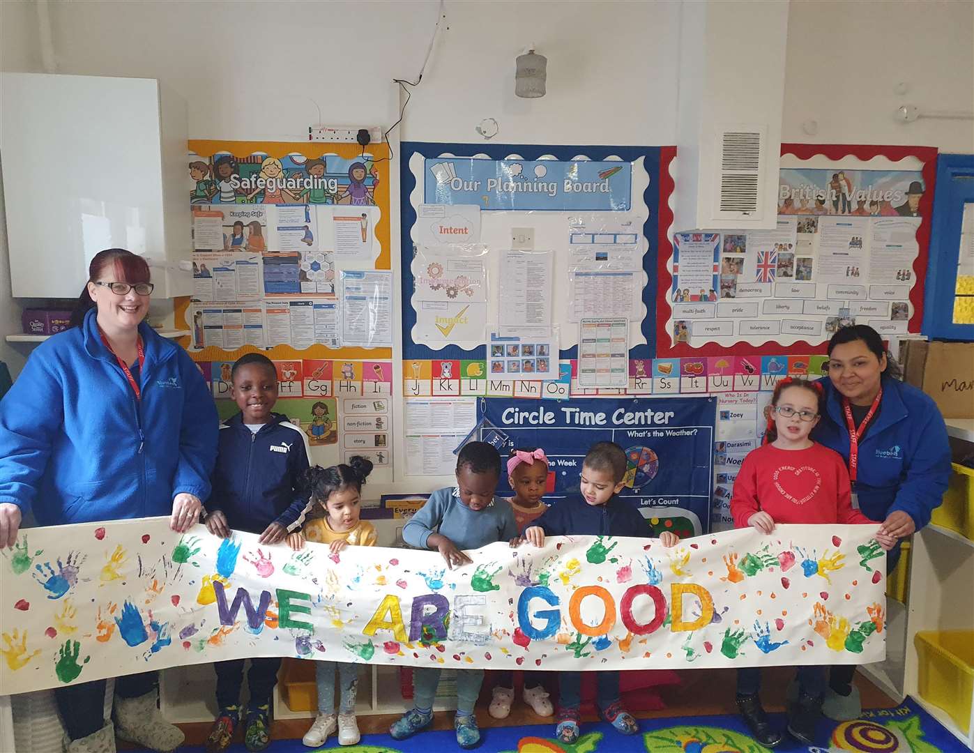 Staff Candy Crouch, left, and Lakshmi Kaur and children at Bluebells Childcare Services