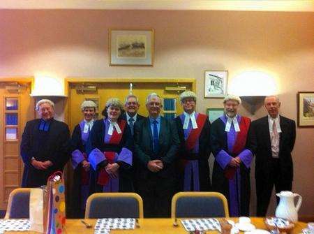 Retiring Crown Court security guard Peter Simmons with judges and staff