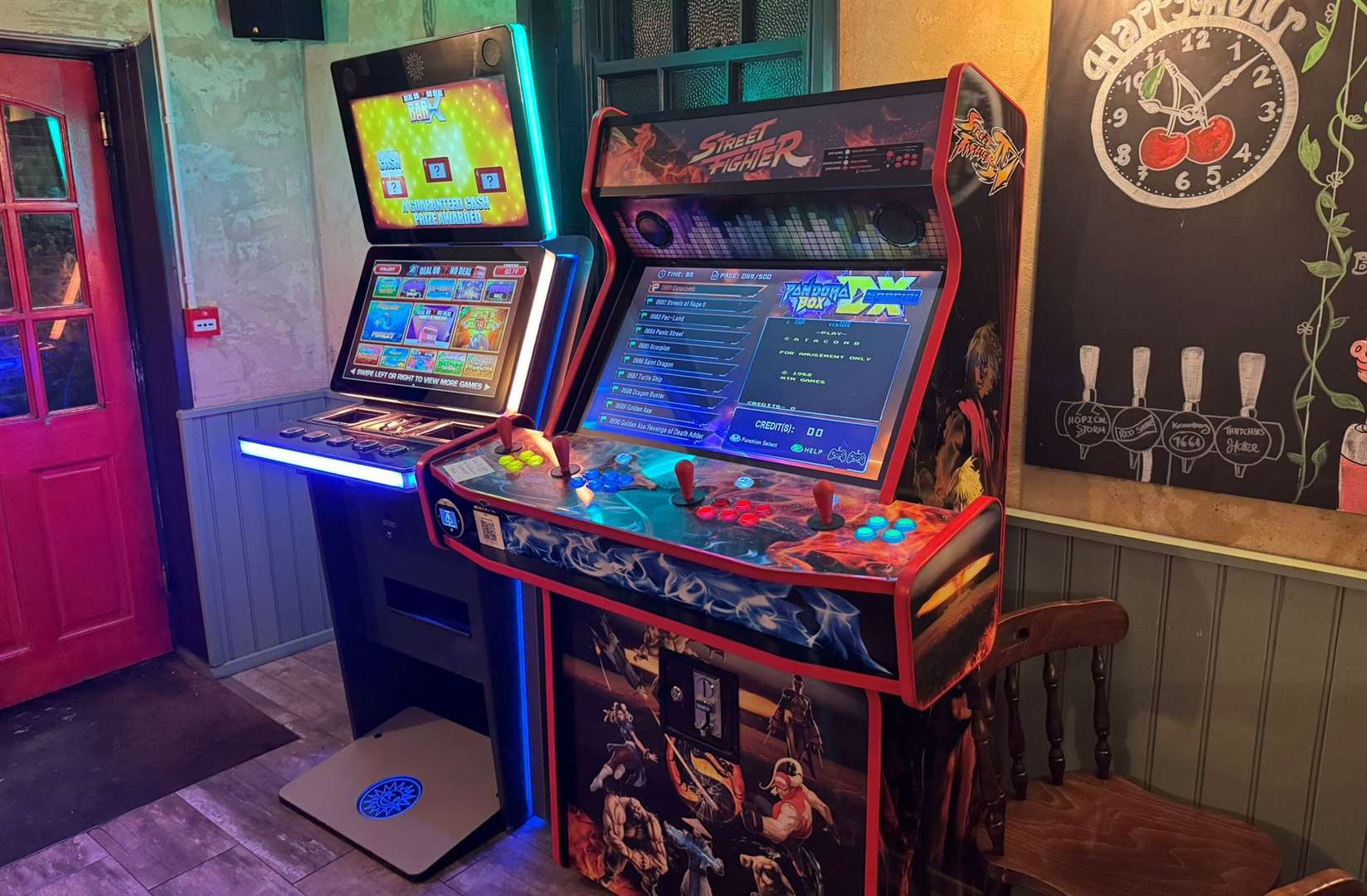 The fruit machine is very much a modern electronic version, but the Street Fighter machine next to it looked a lot more retro